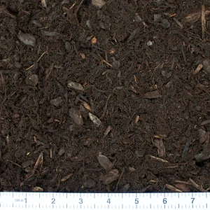 aged fir bark dust with a ruler for scale